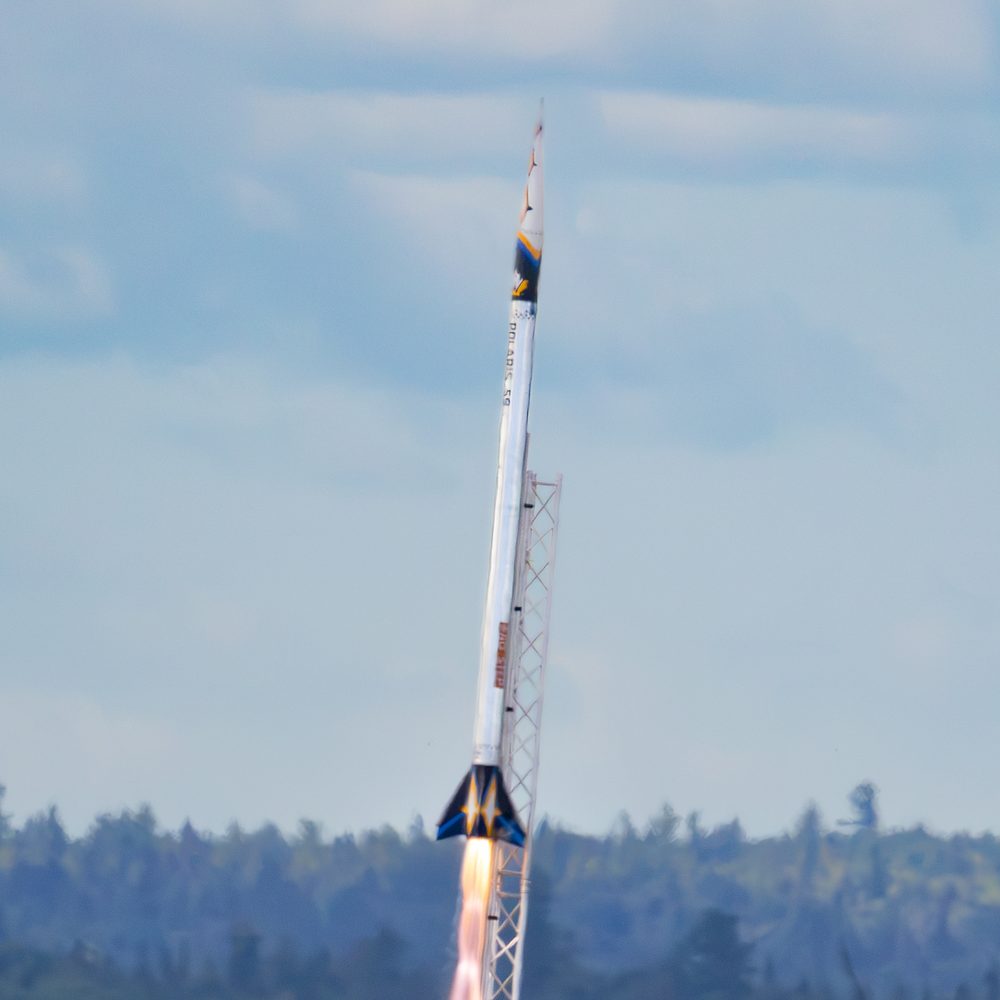 Polaris lifting off the rail, the plume filling the pad
